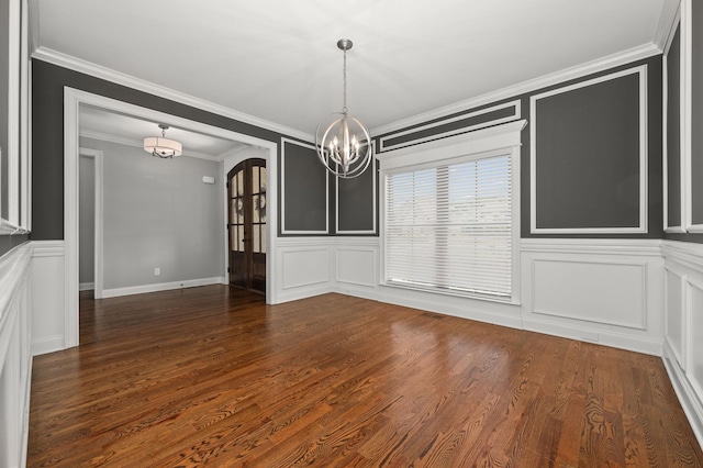 193 Knoxleigh Way, Murfreesboro, TN 37129 - unfurnished dining area featuring a chandelier, arched walkways, a decorative wall, ornamental molding, and dark wood-style floors