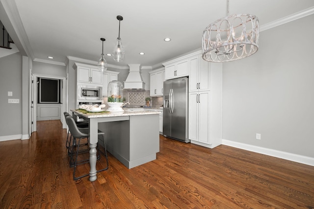 193 Knoxleigh Way, Murfreesboro, TN 37129 - kitchen with appliances with stainless steel finishes, premium range hood, an island with sink, recessed lighting, and backsplash