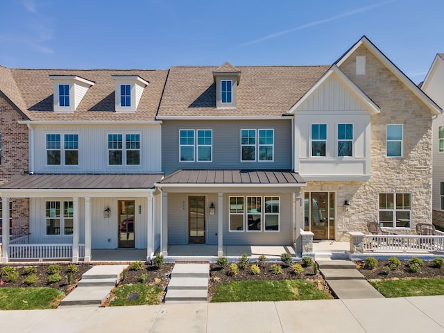 4072 Penfield Dr Unit B, Franklin, TN 37069 - view of front of house with a porch, board and batten siding, roof with shingles, a metal roof, and stone siding