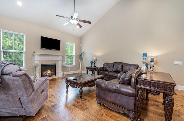 813 Stone Mill Cir, Murfreesboro, TN 37130 - living area featuring ceiling fan, wood finished floors, a fireplace with flush hearth, baseboards, and high vaulted ceiling