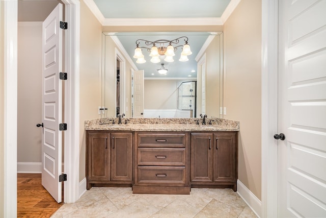 813 Stone Mill Cir, Murfreesboro, TN 37130 - bathroom featuring double vanity, crown molding, a chandelier, and baseboards