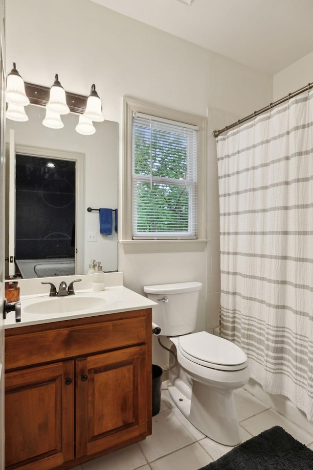 6781 Autumnwood Dr, Nashville, TN 37221 - full bath featuring toilet, vanity, tile patterned floors, and a shower with curtain