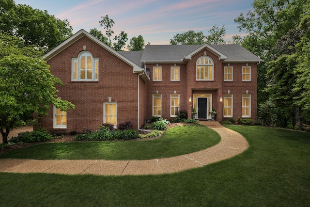 6781 Autumnwood Dr, Nashville, TN 37221 - view of front of home featuring a yard and brick siding