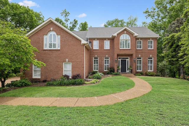 6781 Autumnwood Dr, Nashville, TN 37221 - colonial inspired home featuring a front lawn and brick siding
