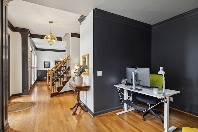 6781 Autumnwood Dr, Nashville, TN 37221 - office space featuring crown molding, wood finished floors, ornate columns, a chandelier, and baseboards
