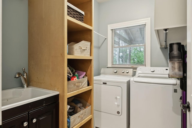 6781 Autumnwood Dr, Nashville, TN 37221 - washroom featuring washer and clothes dryer and cabinet space