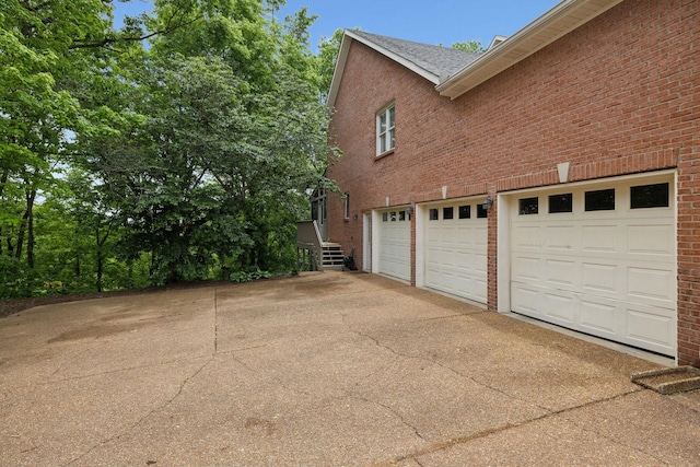 6781 Autumnwood Dr, Nashville, TN 37221 - garage featuring concrete driveway