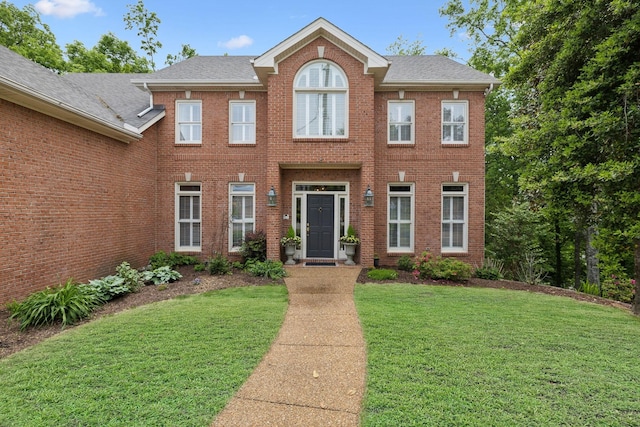 6781 Autumnwood Dr, Nashville, TN 37221 - view of front of property with a front lawn, brick siding, and a shingled roof