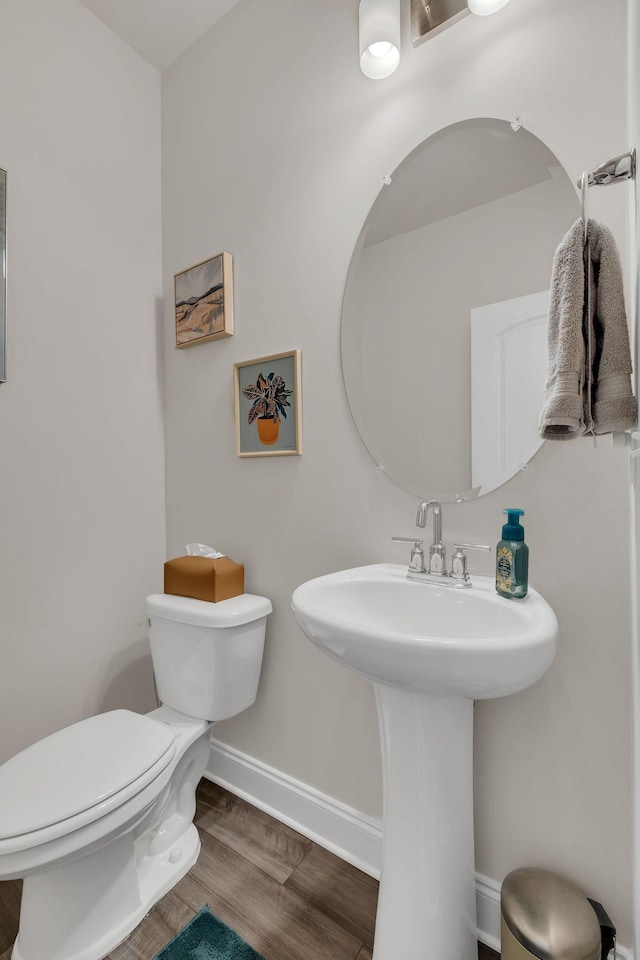 1736 Tahoma Dr, Lebanon, TN 37087 - bathroom featuring toilet, wood finished floors, baseboards, and a sink