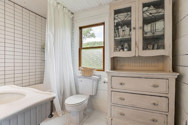 3975 Dry Creek Rd, Dowelltown, TN 37059 - bathroom with toilet, a shower with shower curtain, tile walls, vanity, and tile patterned floors