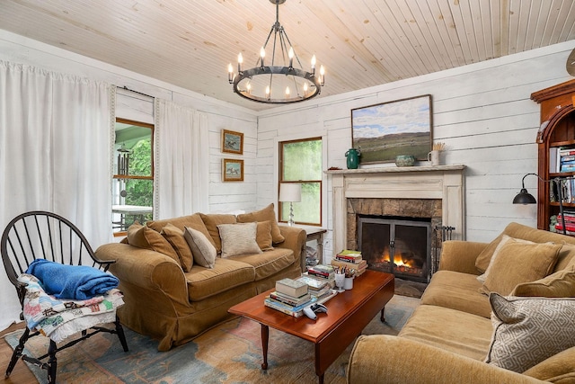 3975 Dry Creek Rd, Dowelltown, TN 37059 - living area with a fireplace, a chandelier, wood finished floors, wooden ceiling, and wooden walls