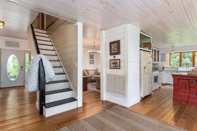 3975 Dry Creek Rd, Dowelltown, TN 37059 - stairs featuring wood-type flooring, wooden ceiling, and a chandelier