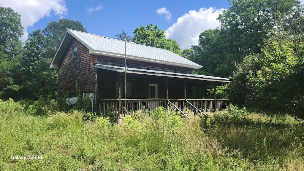 1935 Fairview Rd, Tellico Plains, TN 37385 - view of side of home featuring metal roof and a porch