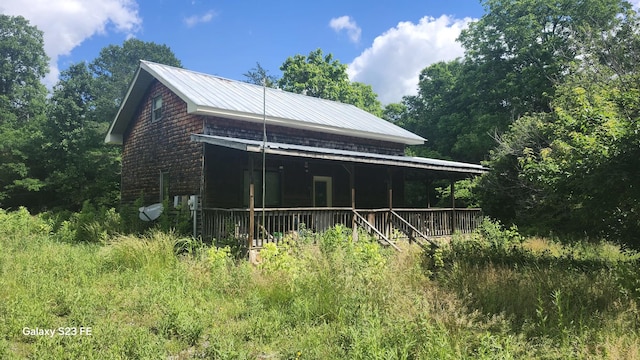 1935 Fairview Rd, Tellico Plains, TN 37385 - view of side of home featuring metal roof and a porch