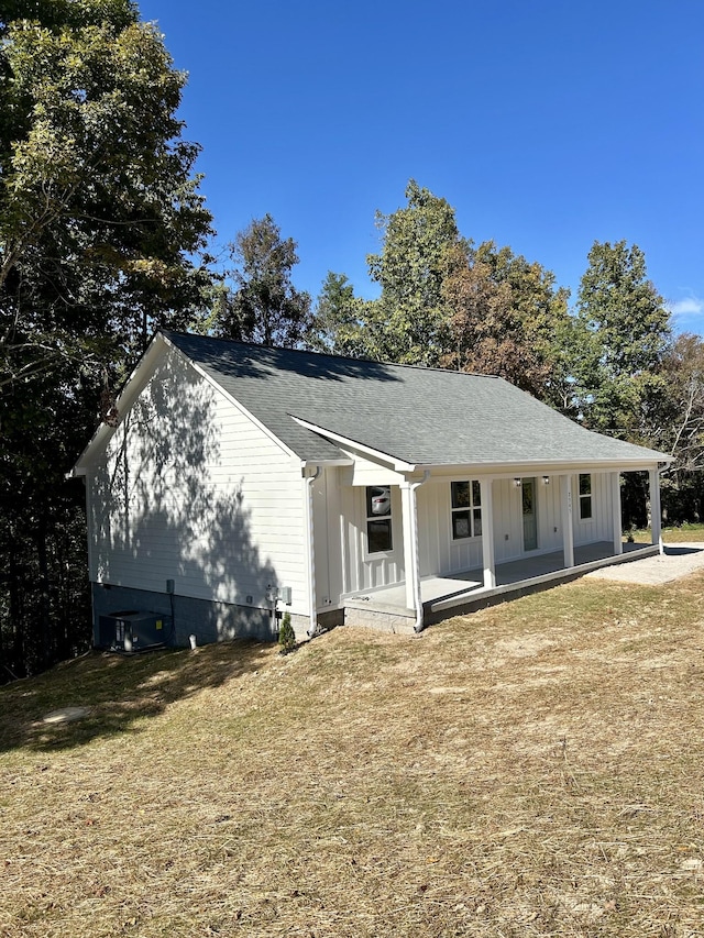 5724 Little Dry Creek Rd, Pulaski, TN 38478 - view of front facade featuring a porch, board and batten siding, and a shingled roof