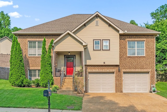 2157 Christina Ct, Hermitage, TN 37076 - view of front of house featuring brick siding, an attached garage, driveway, and roof with shingles