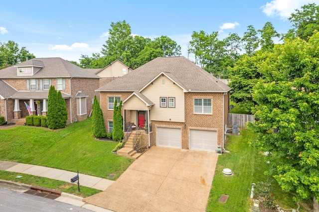 2157 Christina Ct, Hermitage, TN 37076 - view of front of home with brick siding, driveway, and an attached garage