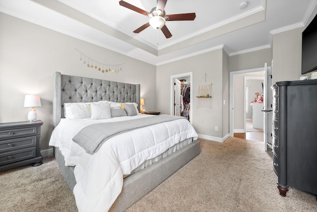 2157 Christina Ct, Hermitage, TN 37076 - bedroom with a tray ceiling, light colored carpet, a walk in closet, baseboards, and crown molding