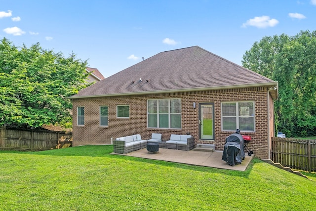 2157 Christina Ct, Hermitage, TN 37076 - back of property featuring roof with shingles, brick siding, and a patio area
