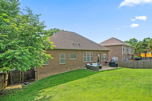 2157 Christina Ct, Hermitage, TN 37076 - back of property featuring a patio area, brick siding, outdoor lounge area, and a shingled roof