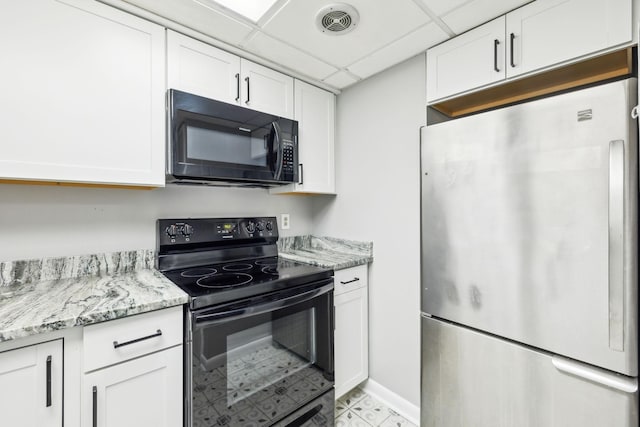 210 Old Hickory Blvd Unit 42, Nashville, TN 37221 - kitchen featuring black appliances, white cabinets, light stone countertops, and a drop ceiling