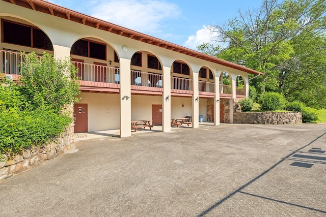 210 Old Hickory Blvd Unit 42, Nashville, TN 37221 - back of property featuring stucco siding, a balcony, and a patio