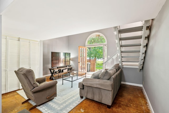 210 Old Hickory Blvd Unit 42, Nashville, TN 37221 - living room with stairs, baseboards, and finished concrete floors