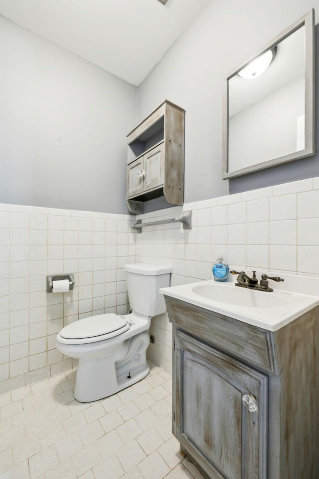 210 Old Hickory Blvd Unit 42, Nashville, TN 37221 - bathroom featuring toilet, tile walls, vanity, tile patterned floors, and wainscoting