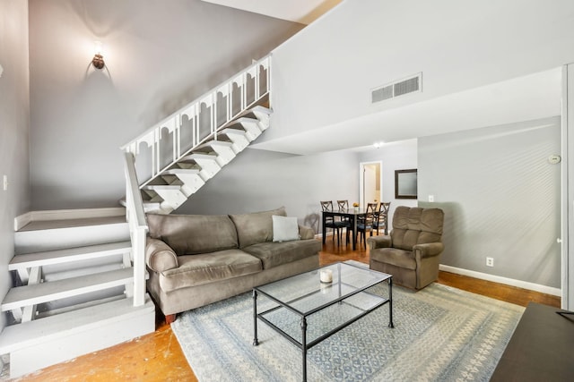 210 Old Hickory Blvd Unit 42, Nashville, TN 37221 - living area featuring baseboards, wood finished floors, a towering ceiling, and stairway