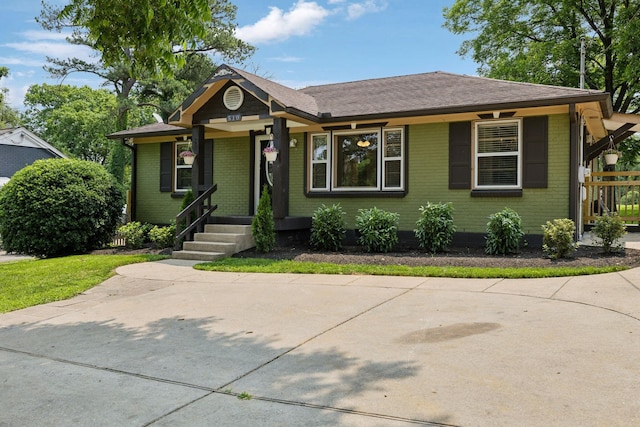 510 Bismark Dr, Nashville, TN 37210 - view of front of property with brick siding, covered porch, and a shingled roof