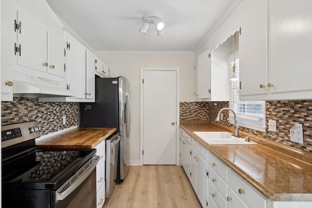 510 Bismark Dr, Nashville, TN 37210 - kitchen with stainless steel range with electric stovetop, a sink, under cabinet range hood, light wood-style flooring, and white cabinetry