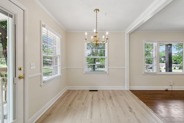 510 Bismark Dr, Nashville, TN 37210 - unfurnished dining area featuring a chandelier, wood finished floors, ornamental molding, and baseboards