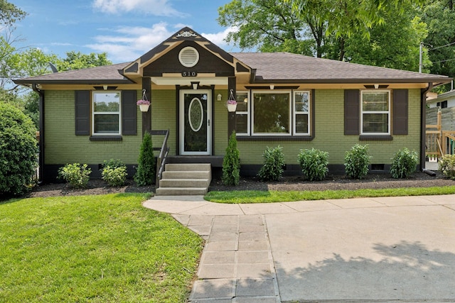 510 Bismark Dr, Nashville, TN 37210 - view of front of house with a front lawn, roof with shingles, brick siding, and crawl space