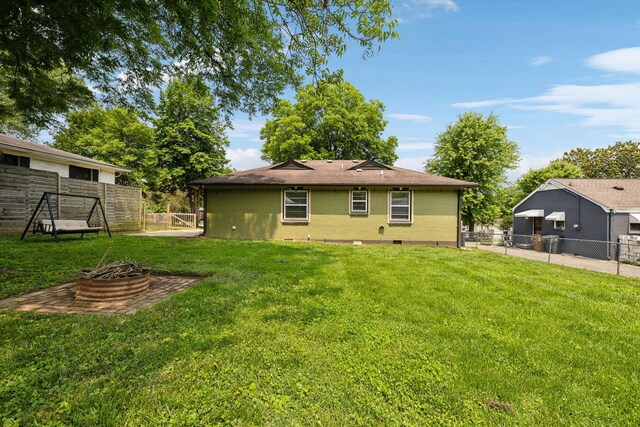 510 Bismark Dr, Nashville, TN 37210 - back of property with an outdoor fire pit and brick siding