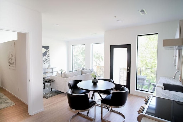 806 Olympic St Unit 305, Nashville, TN 37203 - dining area with light wood-style floors and healthy amount of natural light