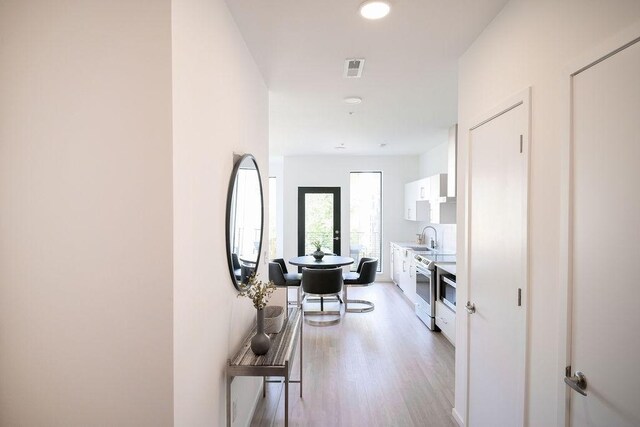 806 Olympic St Unit 305, Nashville, TN 37203 - hall featuring light wood-type flooring and a sink
