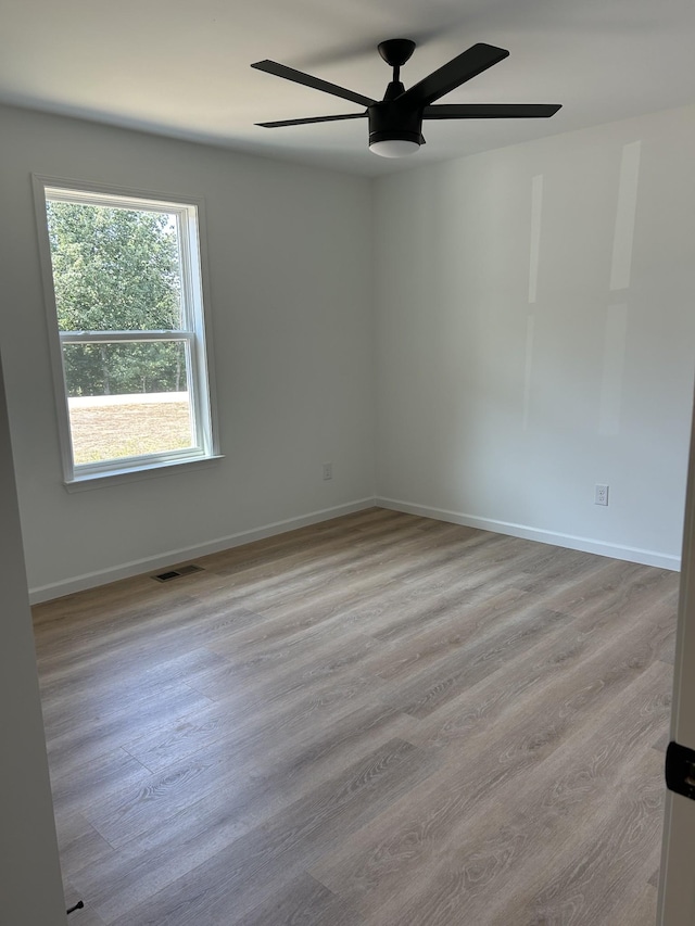 5716 Little Dry Creek Rd, Pulaski, TN 38478 - spare room with a ceiling fan, wood finished floors, and baseboards