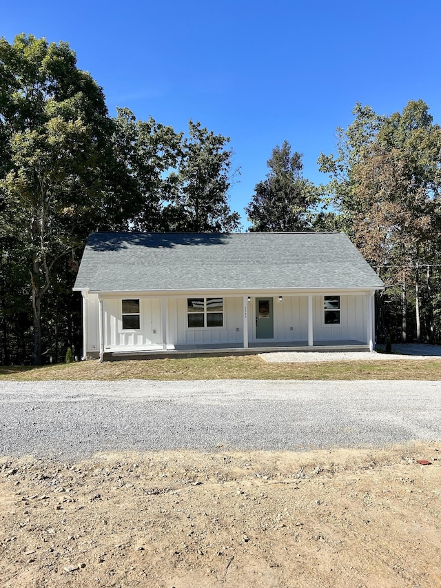 5716 Little Dry Creek Rd, Pulaski, TN 38478 - view of front of house with covered porch, board and batten siding, and a shingled roof