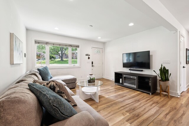 304 Jenny Murff Dr, Antioch, TN 37013 - living room featuring light wood finished floors, recessed lighting, and baseboards