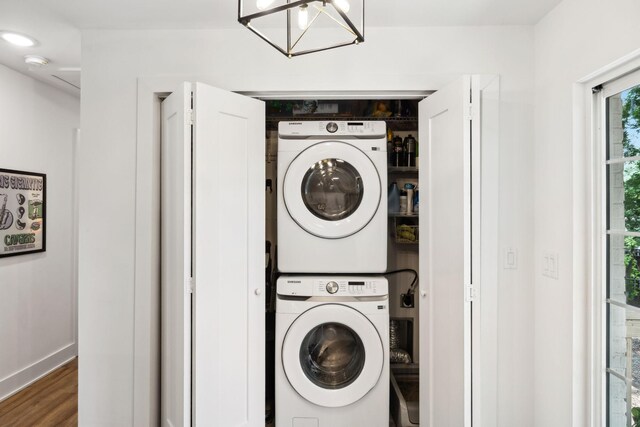 304 Jenny Murff Dr, Antioch, TN 37013 - laundry room featuring stacked washer / drying machine, wood finished floors, and baseboards