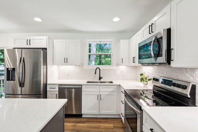 304 Jenny Murff Dr, Antioch, TN 37013 - kitchen featuring stainless steel appliances, a sink, white cabinetry, and recessed lighting