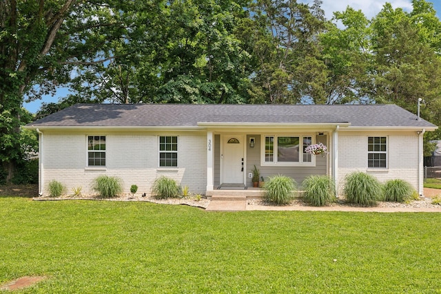 304 Jenny Murff Dr, Antioch, TN 37013 - ranch-style house with brick siding, a front lawn, and roof with shingles