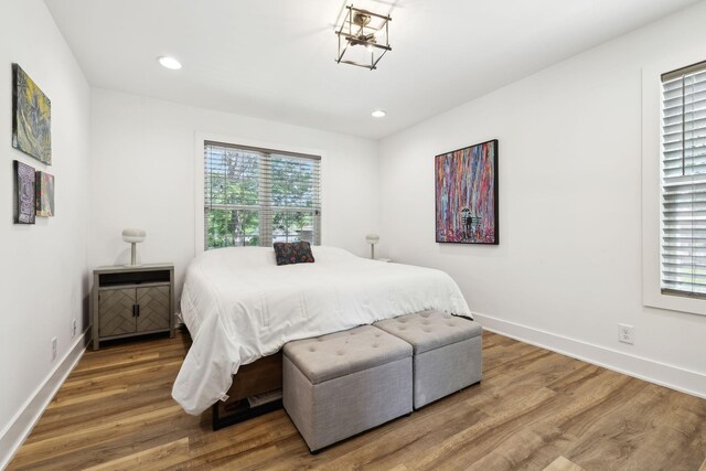 304 Jenny Murff Dr, Antioch, TN 37013 - bedroom with wood finished floors, baseboards, recessed lighting, and a chandelier