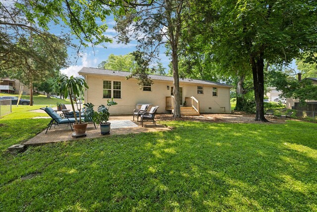 304 Jenny Murff Dr, Antioch, TN 37013 - rear view of house with a patio, brick siding, and crawl space