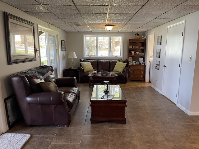 464 Loop Dr, Winchester, TN 37398 - living area featuring a drop ceiling, tile patterned floors, and baseboards