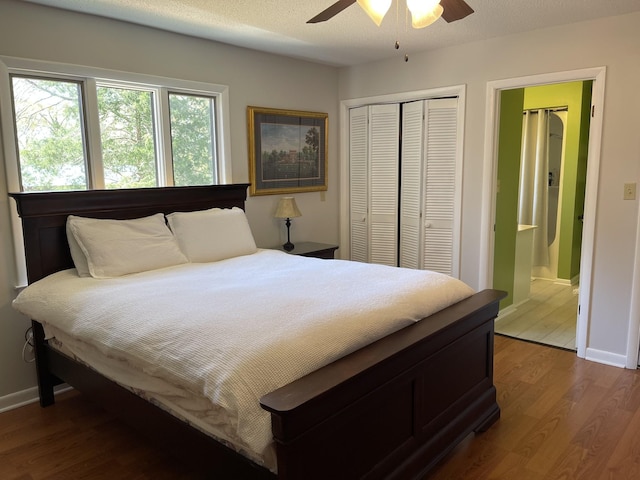 464 Loop Dr, Winchester, TN 37398 - bedroom with wood finished floors, a closet, baseboards, and connected bathroom