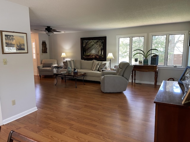 464 Loop Dr, Winchester, TN 37398 - living area featuring ceiling fan, wood finished floors, baseboards, and a textured ceiling