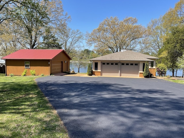 464 Loop Dr, Winchester, TN 37398 - view of side of property with a detached garage, brick siding, and an outdoor structure