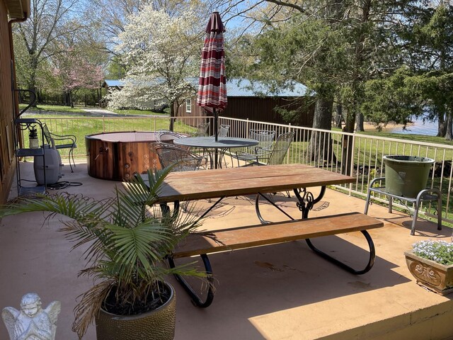 464 Loop Dr, Winchester, TN 37398 - view of patio / terrace featuring a hot tub and outdoor dining area