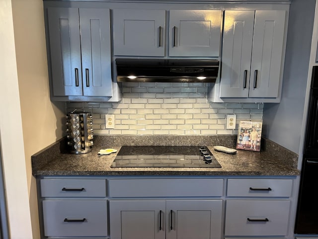 464 Loop Dr, Winchester, TN 37398 - kitchen with black electric cooktop, under cabinet range hood, backsplash, gray cabinetry, and dark stone counters